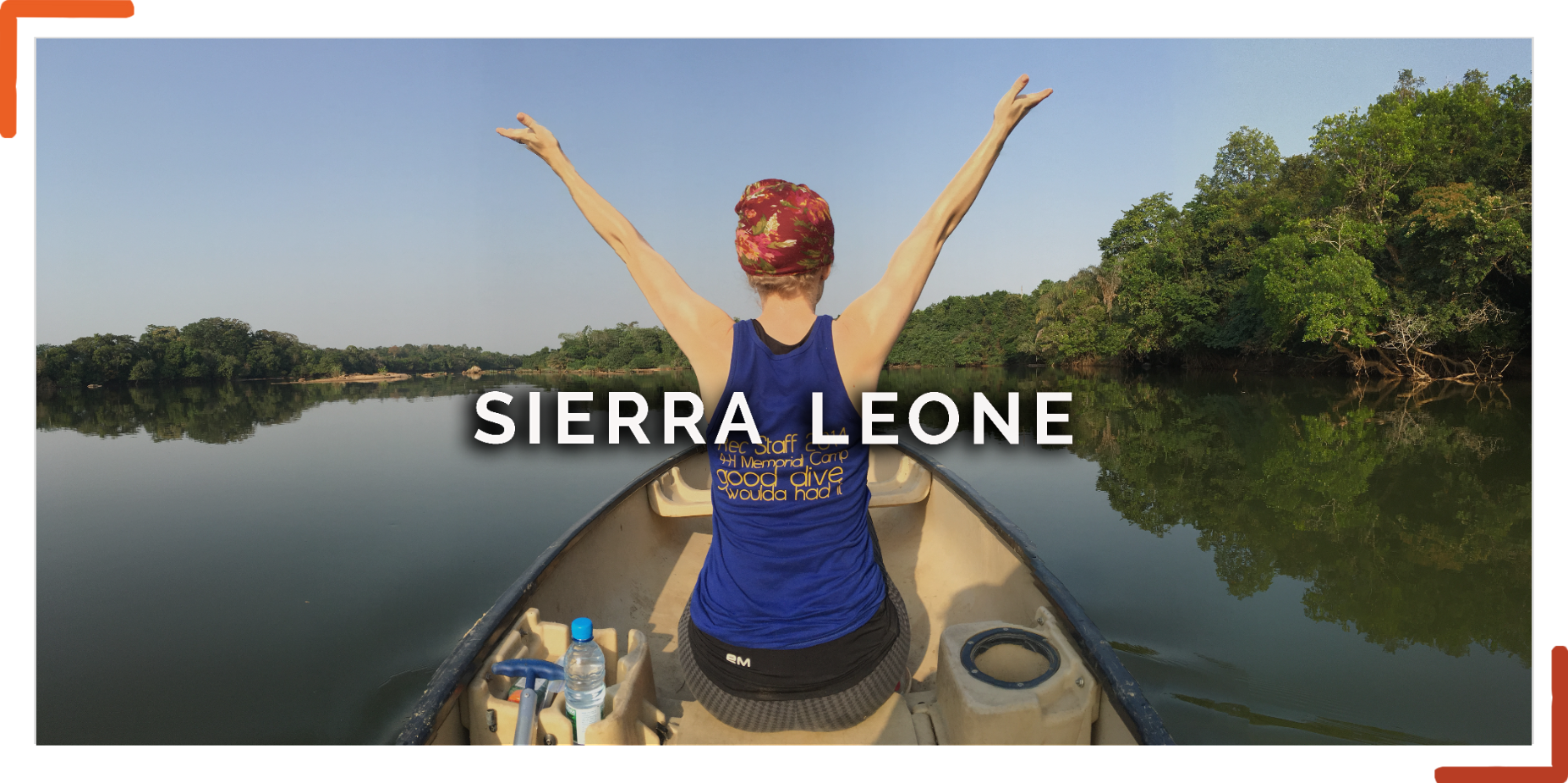 Young girl raising arms on a boat in a river